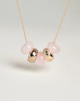 Ava gold necklace with rose quartz beads, evil eye charm, and diamond-detailed charms on a gold chain by MyAleph