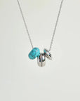Noa silver necklace with turquoise quartz bead and diamond-detailed charms on a silver chain by MyAleph