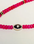 Flat lay of Stella Bag Charm with Evil Eye detail – A detailed view showcasing the pink quartz beads and the zirconia diamond Evil Eye charm, highlighting its protective energy.