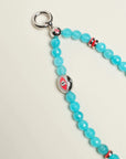 The Leah Bag Charm in Turquoise displayed in full view, featuring vibrant turquoise quartz beads, silver Evil Eye charms, and polished pink dividers for a luxe, meaningful design.