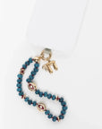 MyAleph Chai Necklace styled with blue phone charm jewelry, gold Hebrew life symbol pendant with white stone