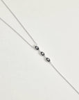 Mayra Evil Eye Body Chain in silver dipped full length view from neck chain to waist chain extension on white surface