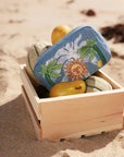 MyAleph Midi Pampelonne Denim Pouch with embroidered Mediterranean sun and palm design styled for summer travel