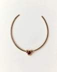 Gold Terre Necklace styled with garnet gemstone charm representing Fire