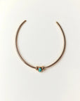Gold Terre Necklace styled with turquoise gemstone charm representing Water
