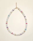 Valerie necklace in white quartz displayed in a flat-lay view, featuring milky white beads accented with multicolored dividers and gold detailing, finished with a delicate chain clasp.
