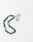 MyAleph Chai Necklace styled with emerald phone charm strap, silver Hebrew life symbol pendant with white stone