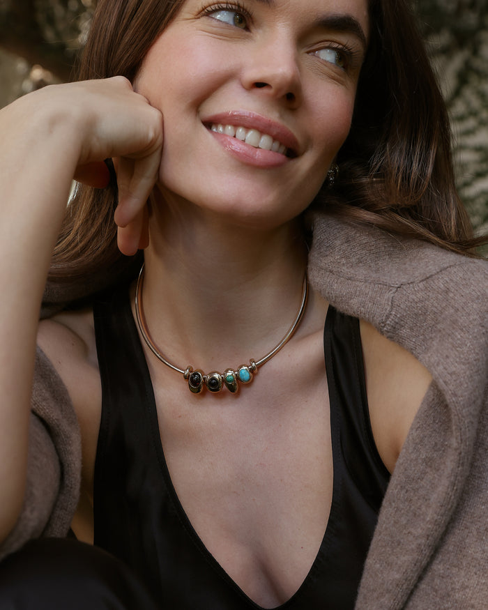 Terre gold choker necklace with gemstone charms, cropped close-up