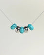 Ava silver necklace with turquoise quartz beads and diamond-detailed charms on a silver chain by MyAleph