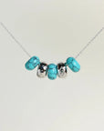 Ava silver necklace with turquoise quartz beads and diamond-detailed charms on a silver chain by MyAleph