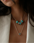 Ava silver necklace layered with the aura evil eye pendant necklace, turquoise quartz beads styled on model by MyAleph
