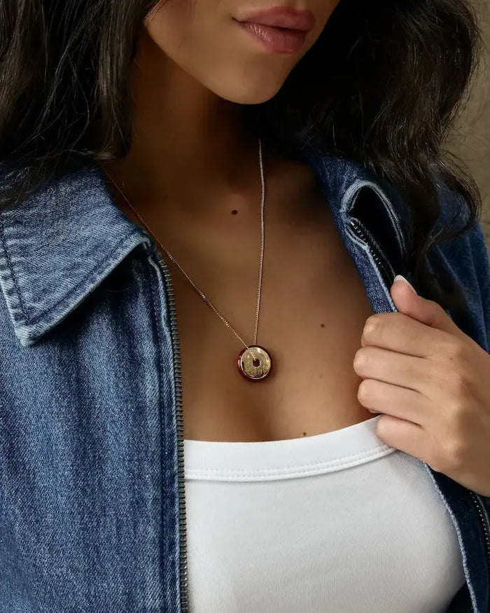 Love gold engraved necklace styled solo on model wearing denim jacket and white top, MyAleph