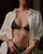 Mayra Evil Eye Body Chain worn on model under an open white shirt falling straight from neck to waist with chain extension