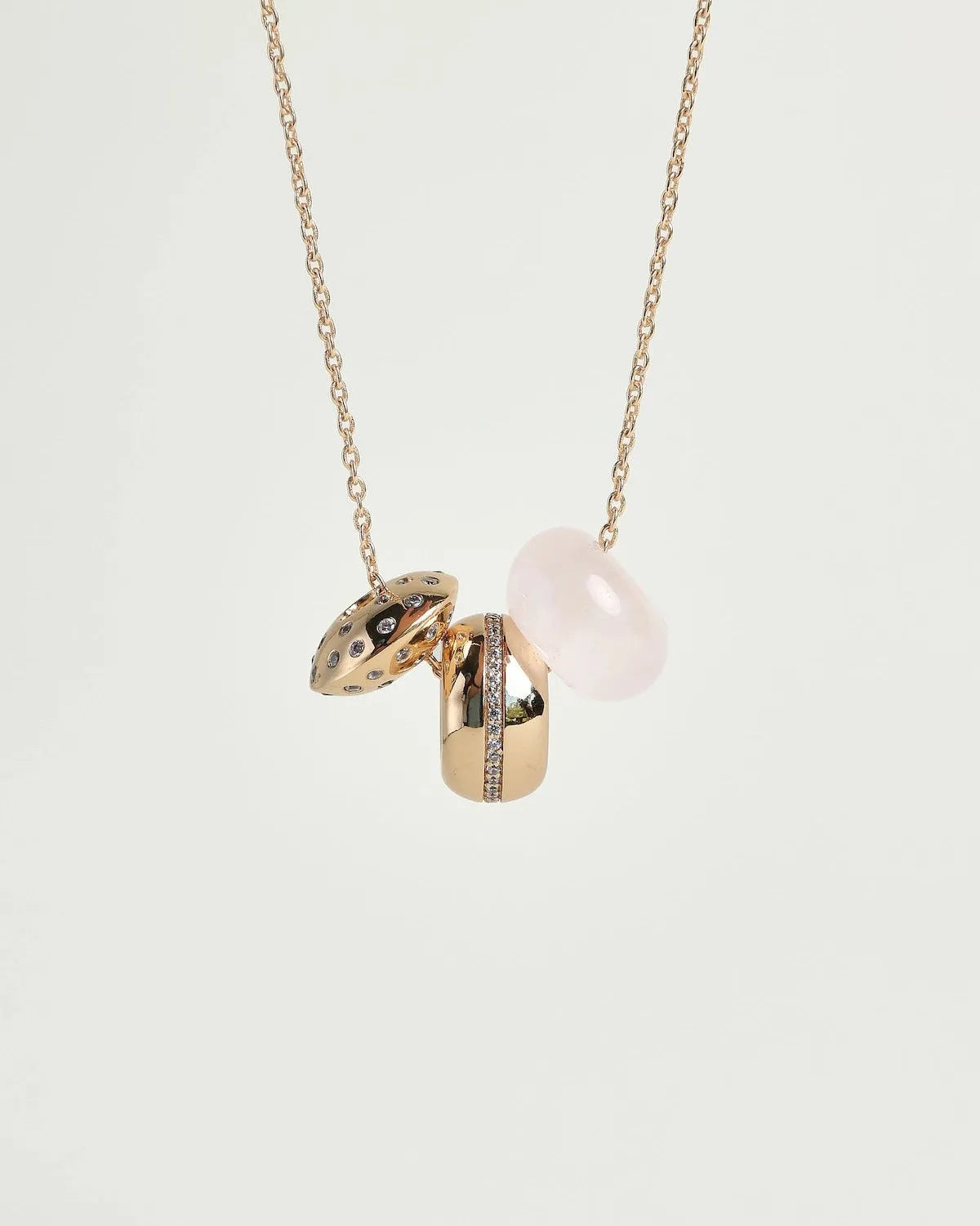 Noa gold necklace with rose quartz bead and diamond-detailed charms on a gold chain by MyAleph