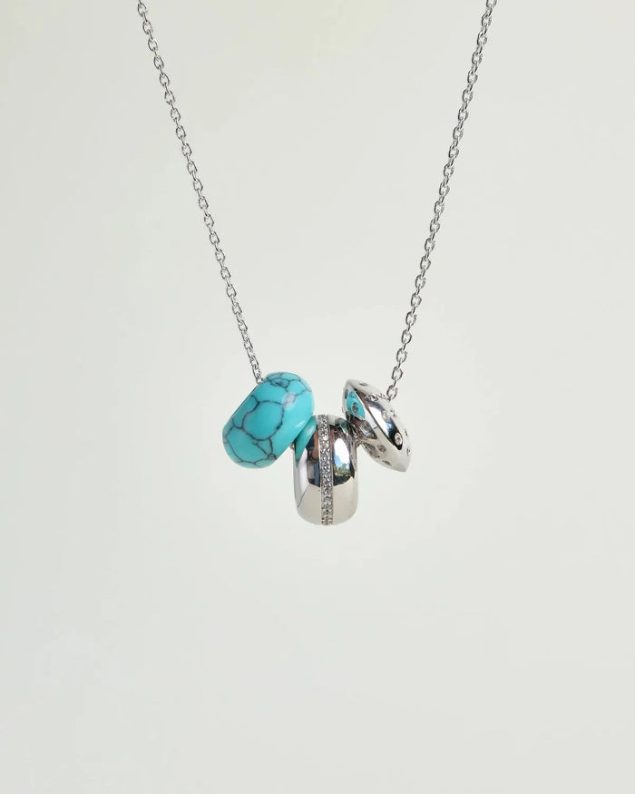 Noa silver necklace with turquoise quartz bead and diamond-detailed charms on a silver chain by MyAleph