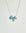 Noa silver necklace with turquoise bead and diamond-detailed charms on a silver chain by MyAleph