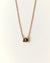Aura Evil Eye necklace with a turquoise gemstone set in a gold plated pendant on a fine chain, styled as a luxury protective talisman.