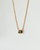 Aura Evil Eye necklace with a turquoise gemstone set in a gold plated pendant on a fine chain, styled as a protective talisman.