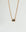 Aura Evil Eye necklace with a turquoise gemstone set in a gold plated pendant on a fine chain, styled as a protective talisman.