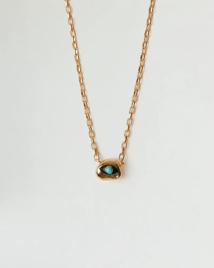 Aura Evil Eye necklace with a turquoise gemstone set in a gold plated pendant on a fine chain, styled as a protective talisman.
