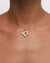 Model wearing MyAleph Chai Necklace, gold Hebrew life symbol pendant with white stone on delicate chain