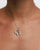 Model wearing MyAleph Chai Necklace, silver Hebrew life symbol pendant with white stone on delicate chain