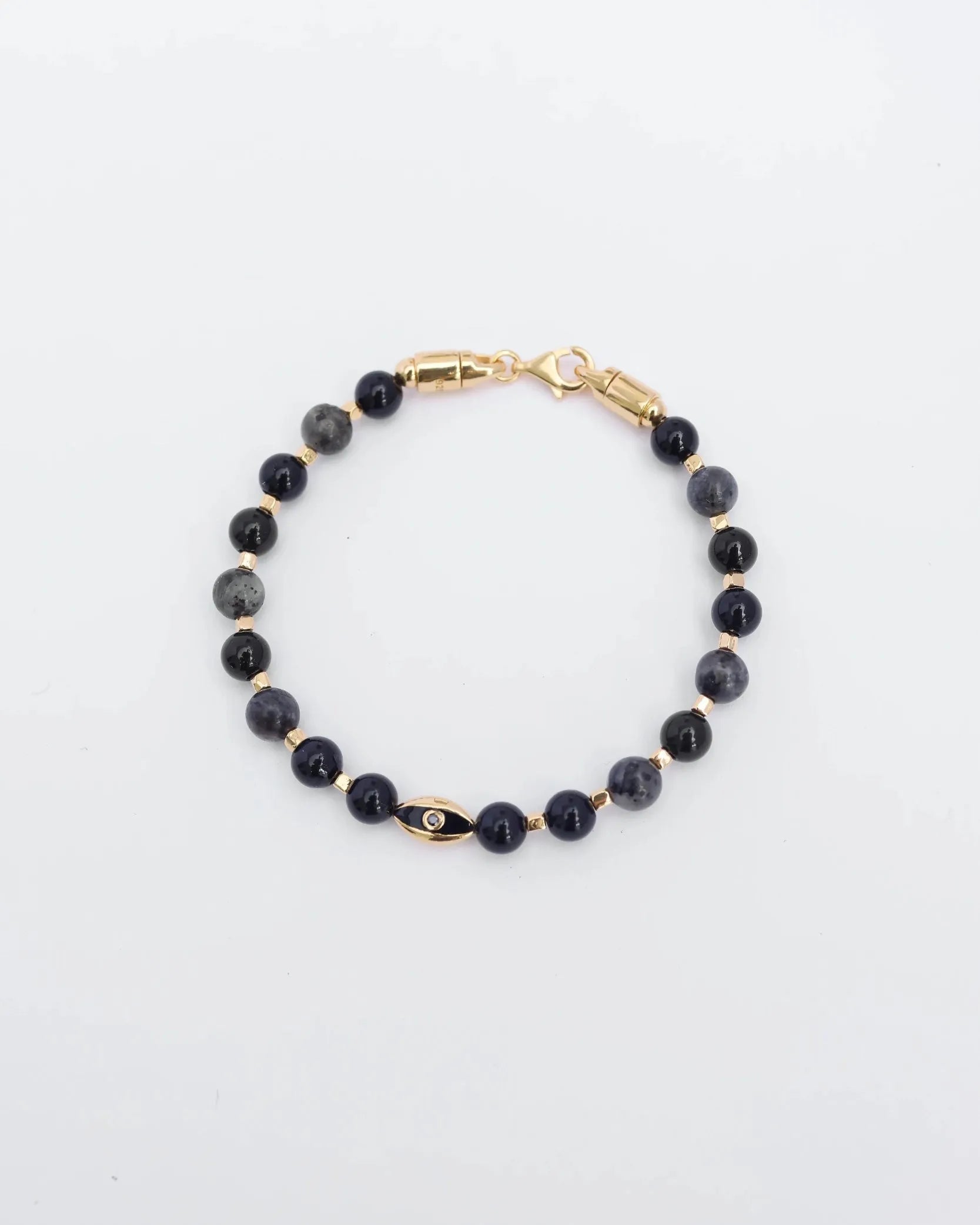 The David Bracelet in 18K Gold laid flat, showcasing its polished gold finish, 6mm black onyx and black labradorite quartz beads, and a single evil eye charm with a black CZ diamond.
