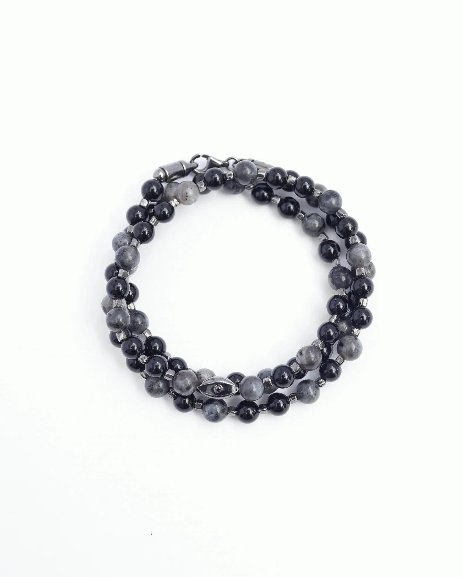 The David Wrap in Black Rhodium laid flat and wrapped, showcasing its bold matte black finish, 6mm black onyx and black labradorite quartz beads, and dual evil eye charms with black CZ diamonds.
