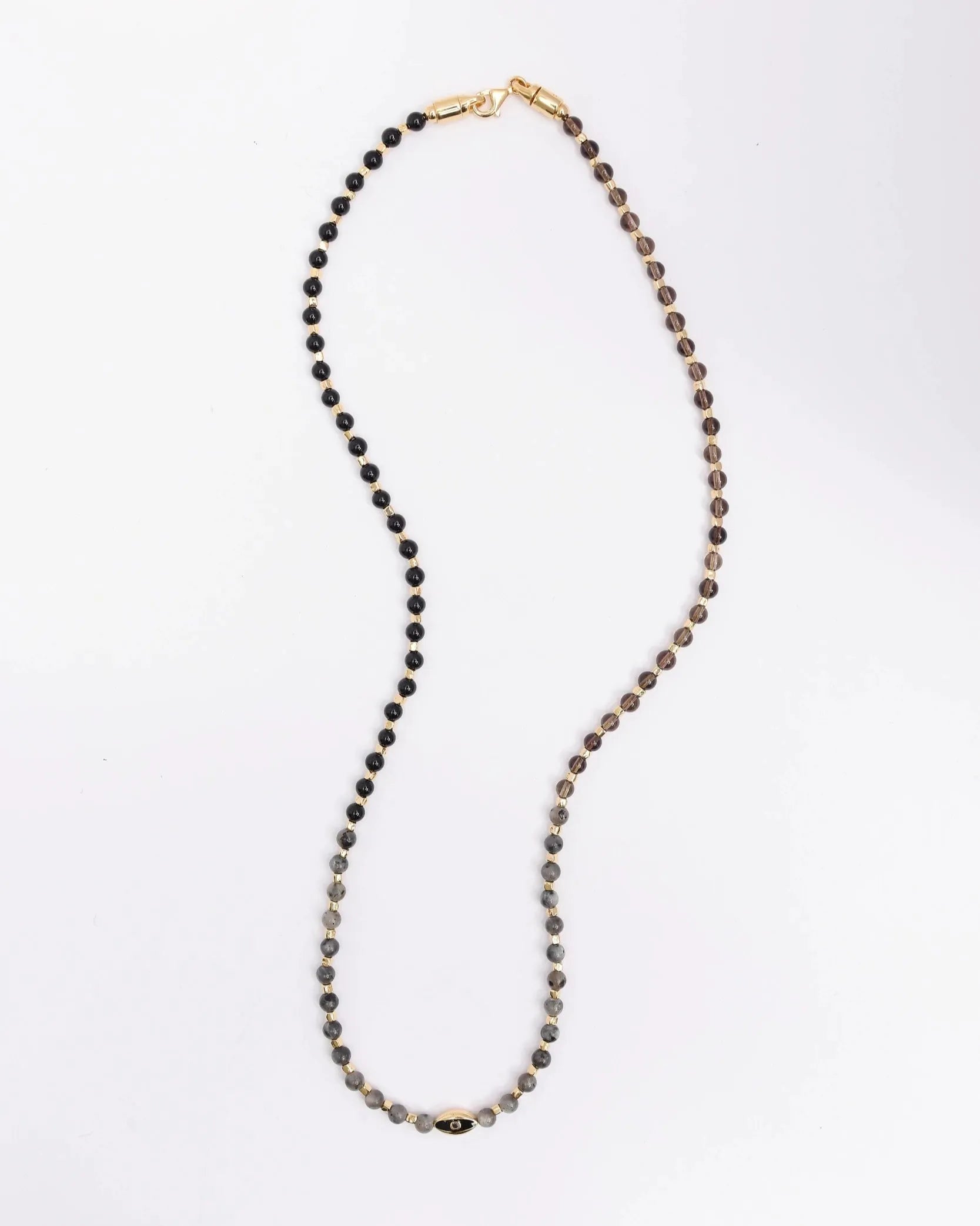 The Ethan Wrap in 18K Gold laid flat in a single strand, showcasing the gold finish, dual evil eye charms, and the rich, earthy tones of the stone beads.