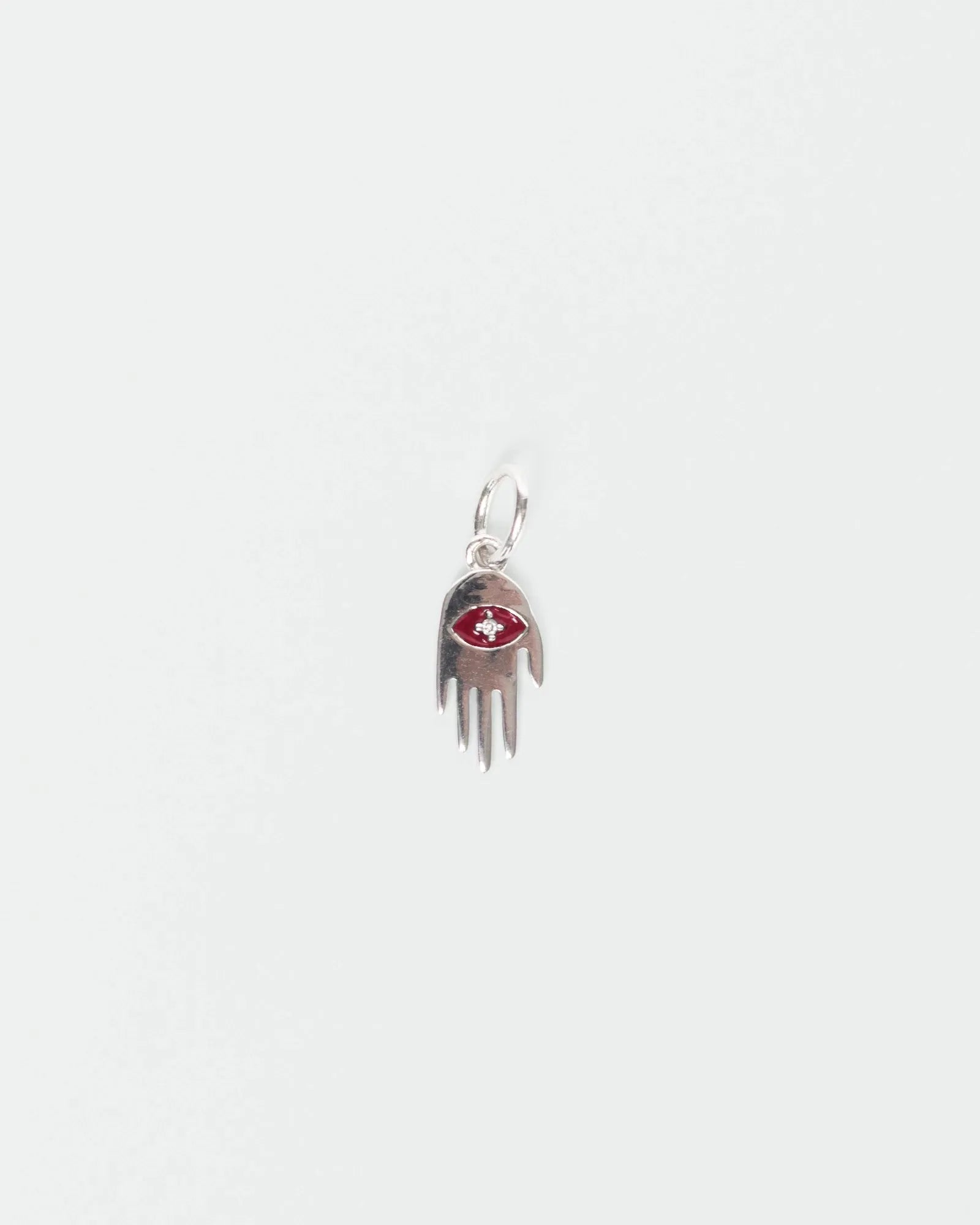 MyAleph silver Flat Hamsa evil eye charm with red enamel eye and white stone center, protective hand pendant