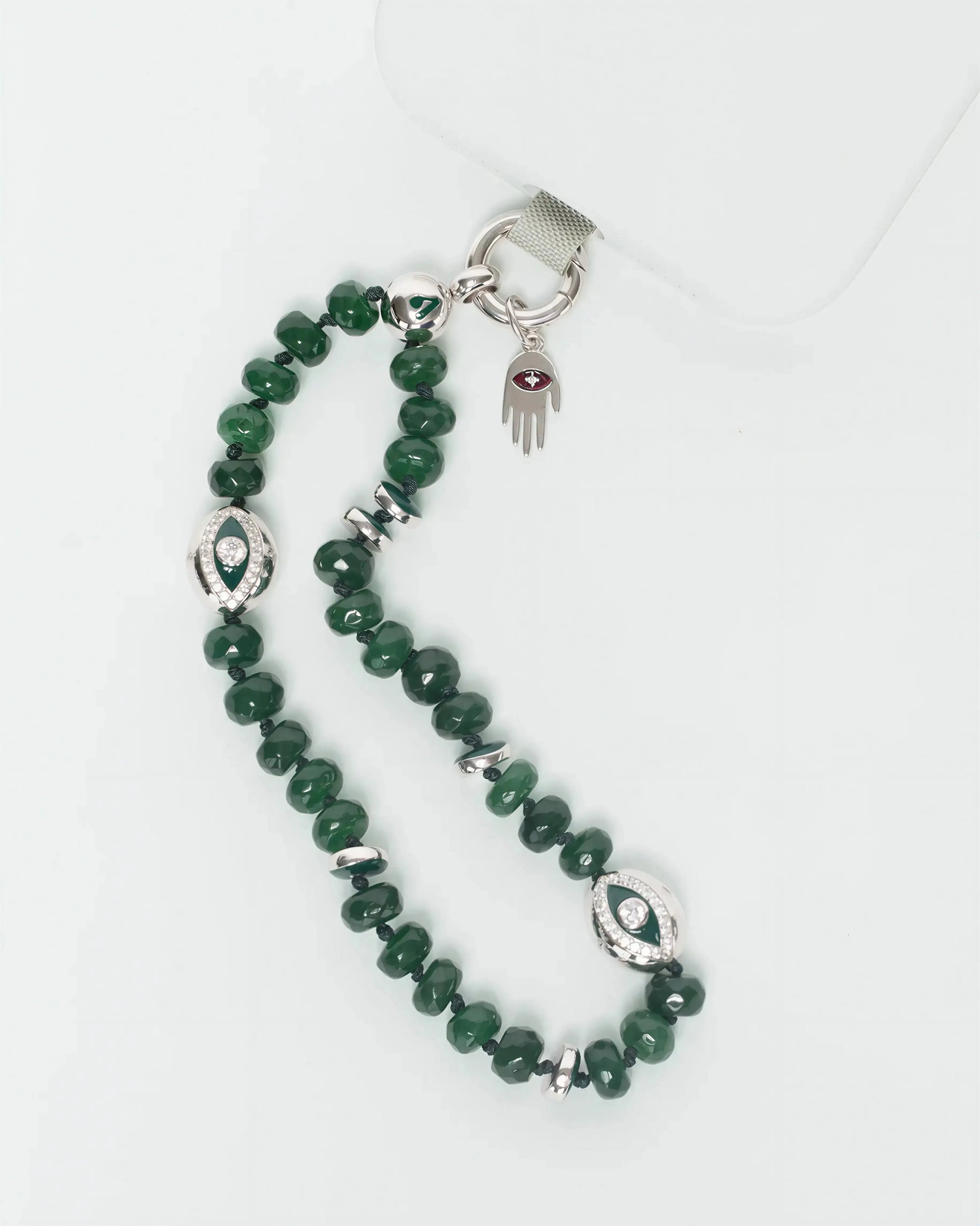 MyAleph silver Flat Hamsa evil eye charm styled with Emerald Phone Charm strap in silver
