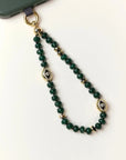 Emerald Leah  Phone Charm displayed in looped form, highlighting gemstone color and gold finishes.