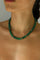 Emerald quartz beaded necklace with gold accents worn on neckline