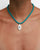 Model wearing MyAleph Lola Cord Necklace with turquoise blue cord and gold evil eye pendant