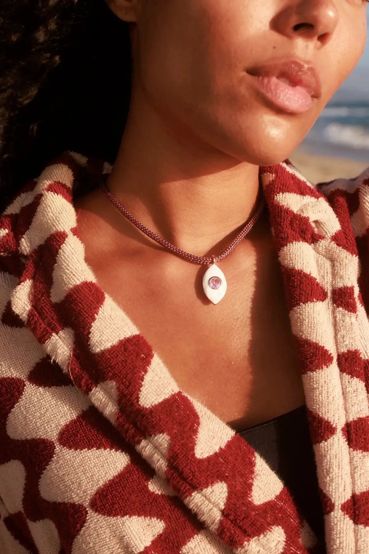 MyAleph Lola Cord Necklace in Sunset styled with bordeaux and rose tones, evil eye pendant for everyday layering