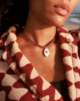 MyAleph Lola Cord Necklace in Sunset styled with bordeaux and rose tones, evil eye pendant for everyday layering