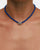 Model wearing MyAleph Luna Cord Necklace with cobalt blue cord and silver evil eye pendant