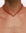 Model wearing MyAleph Luna Cord Necklace with red silk cord and gold evil eye pendant
