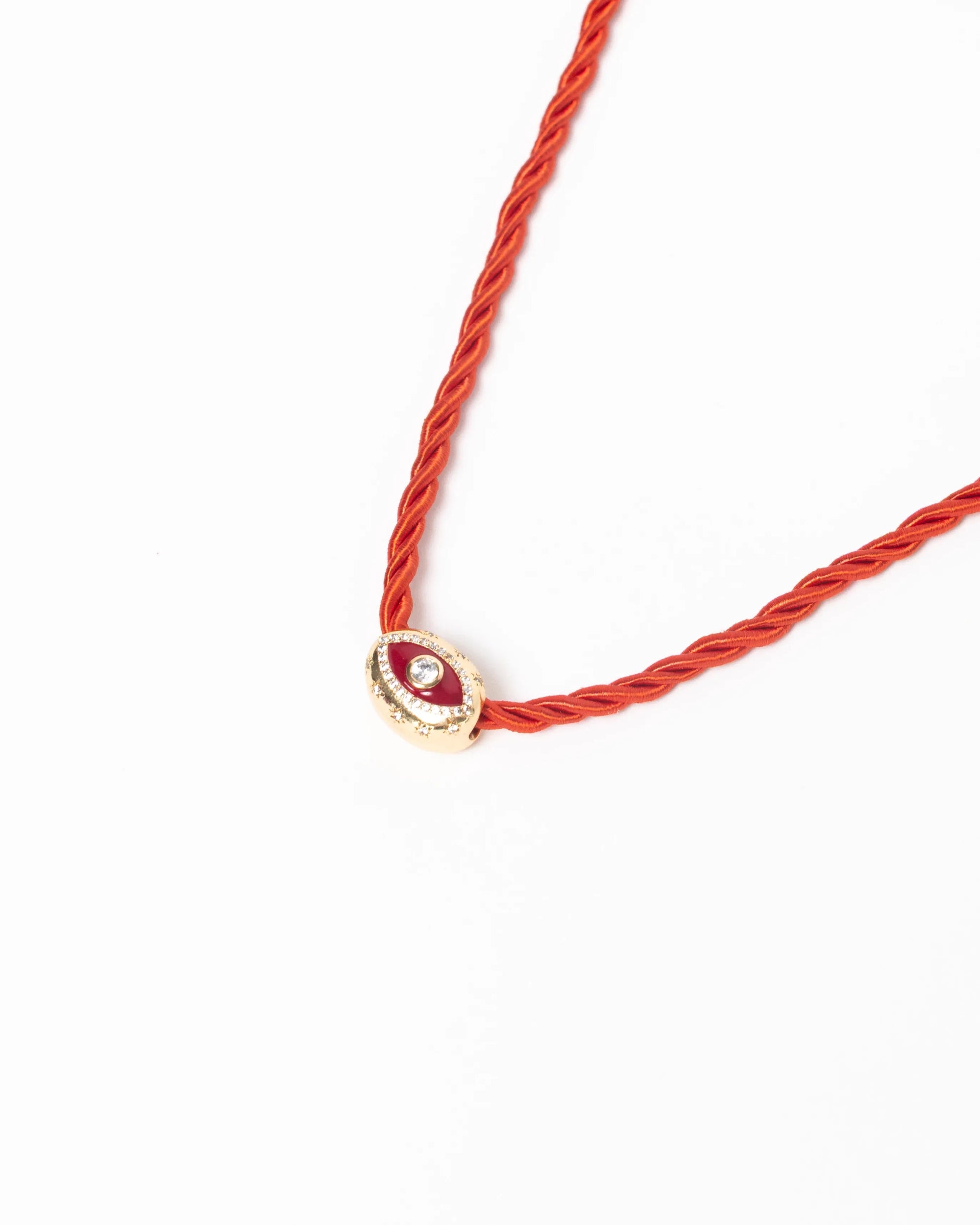 MyAleph Luna Cord Necklace with red silk cord, gold evil eye pendant, and white background