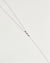 Mayra Evil Eye Body Chain in silver dipped laid flat on white surface with three black enamel evil eye charms at center
