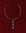 Gold Mayra Evil Eye Choker necklace with a three pendants on a red background