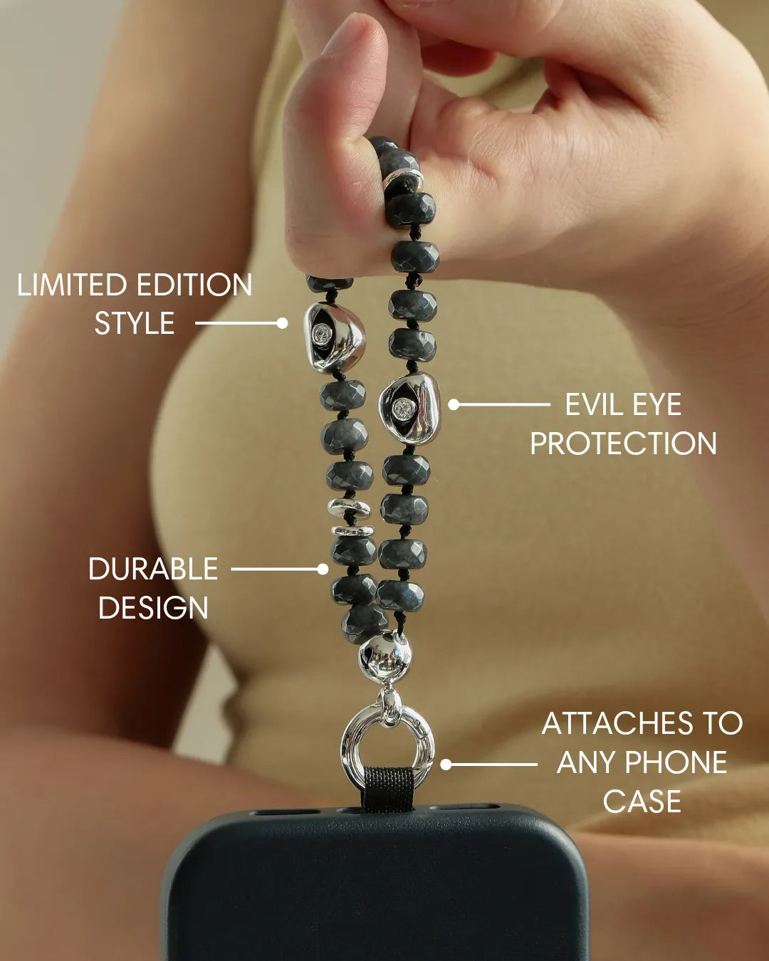 Detail shot of Mini Aura smoky quartz beads with premium dipped silver dividers and evil eye talisman charm.