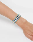 MyAleph Riviera Bracelet on wrist with turquoise and yellow enamel beads, hand-wrapped cotton cord, and adjustable closure
