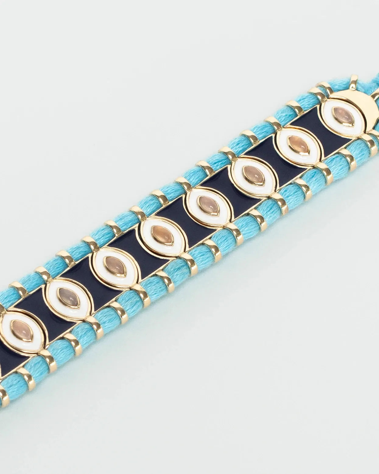 Close-up of MyAleph Riviera Bracelet with glossy turquoise and yellow enamel beads, cotton cord, and adjustable clasp
