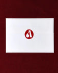 White card with a red logo on a maroon background