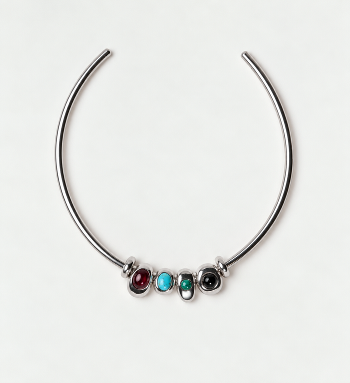 Silver Terre Necklace with garnet, turquoise, malachite and onyx charms on an open choker collar against a light gray background.