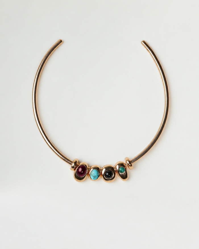 Gold Terre Necklace with four interchangeable gemstone charms representing Fire, Water, Earth, and Air
