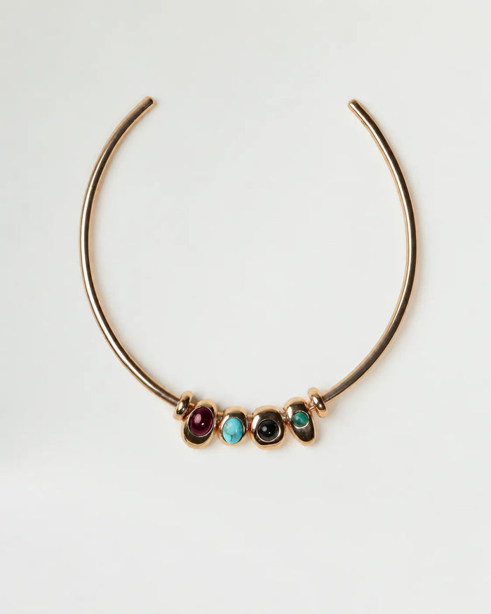 Gold Terre Necklace with four interchangeable gemstone charms representing Fire, Water, Earth, and Air