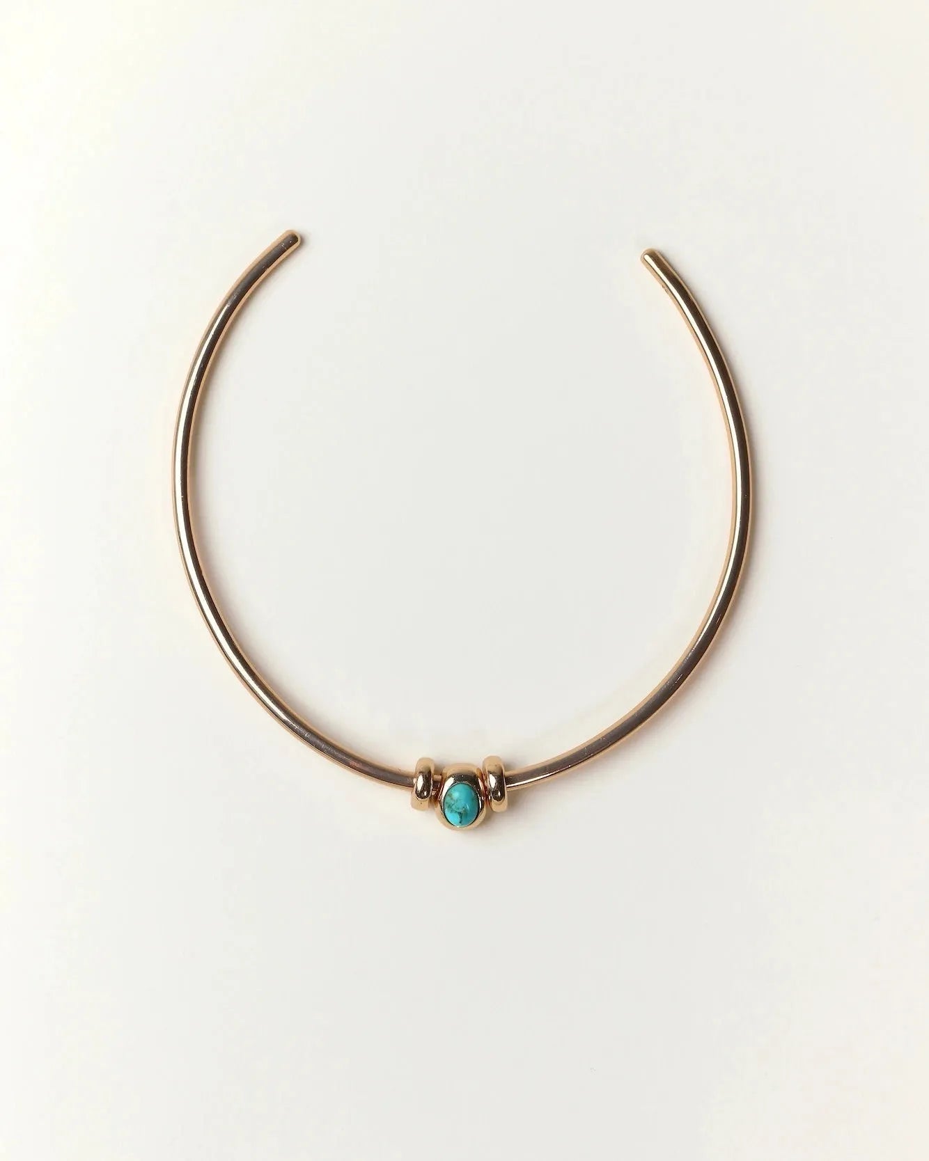 Gold Terre Necklace styled with turquoise gemstone charm representing Water