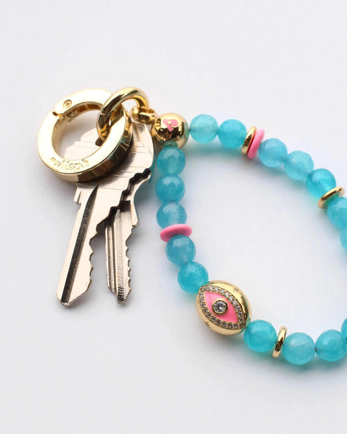 The Ring accessory used as a stylish keyring holder, paired with colorful MyAleph wristlets and charms, showcasing its versatility.
